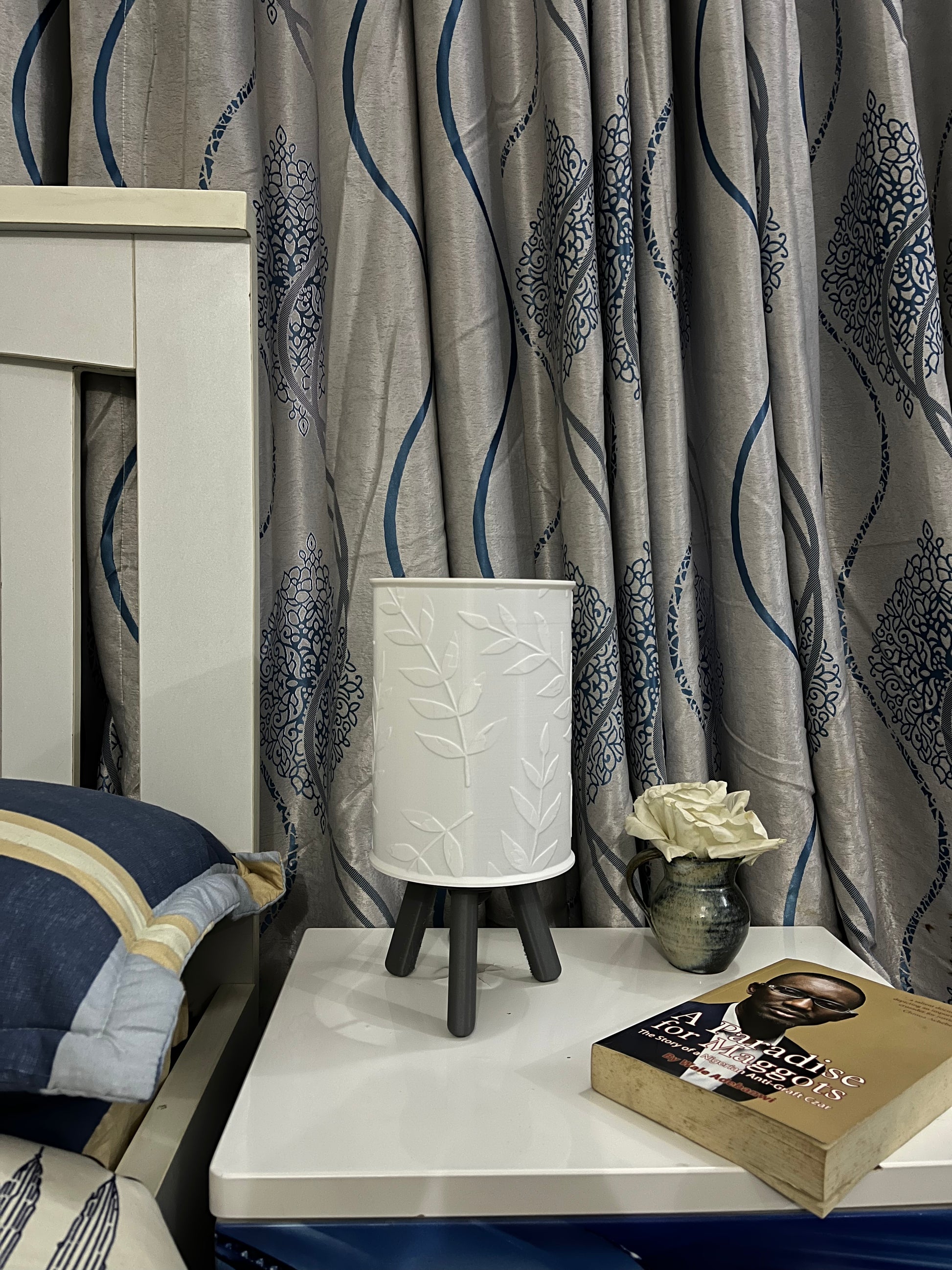 3D printed grey Hako bedside/table lamp on a bedside table with lights off