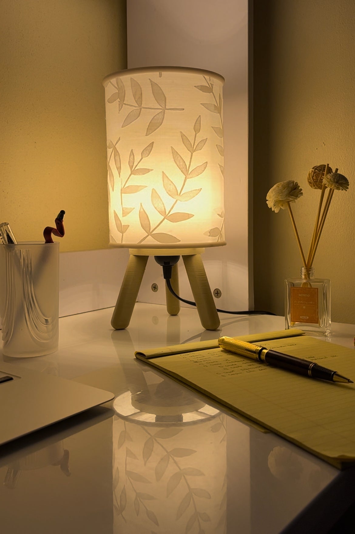 3D printed burlywood Hako bedside/table lamp on a reading table