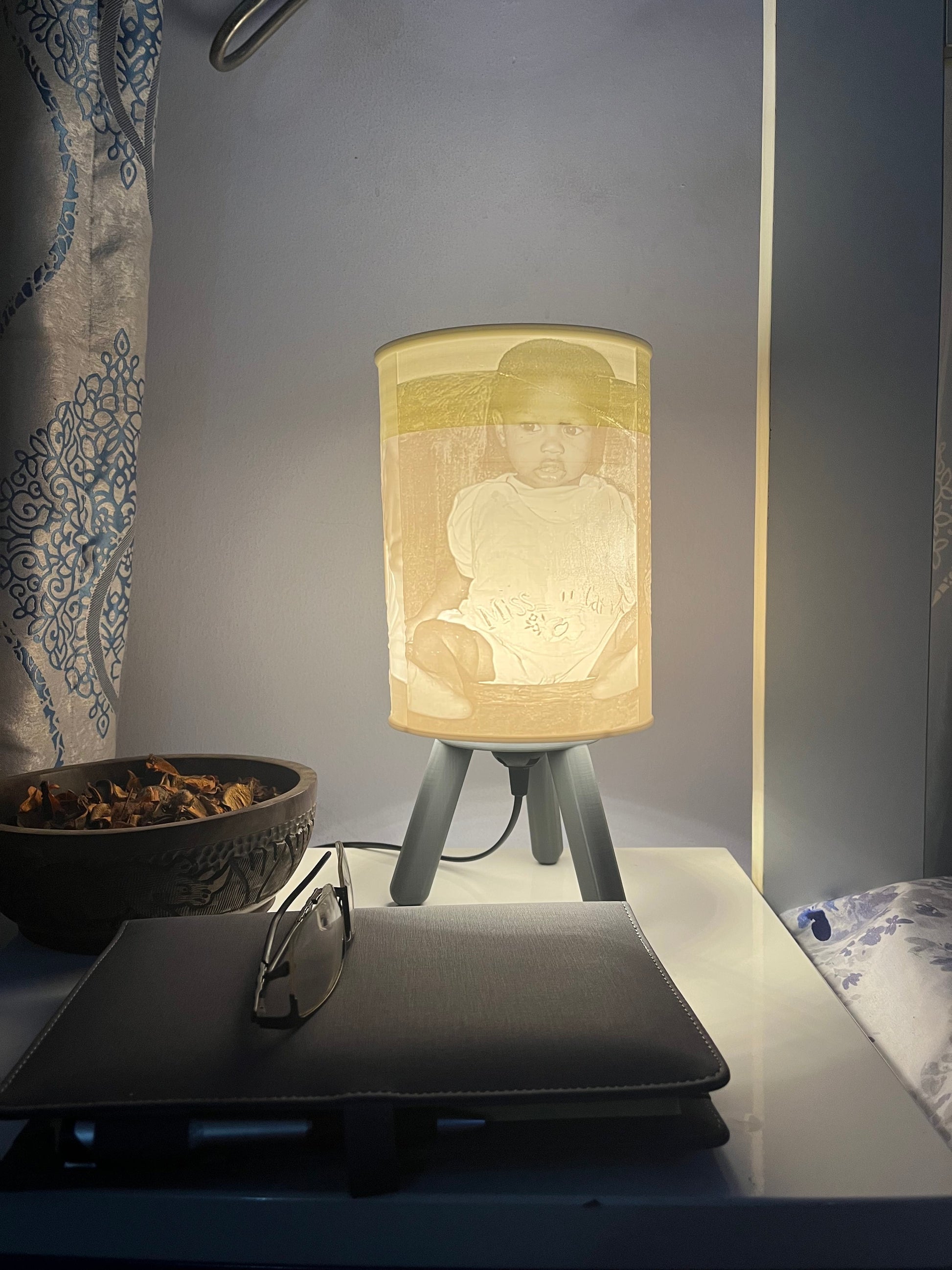 Grey 3D printed custom bedside/table lamp on a bedside table