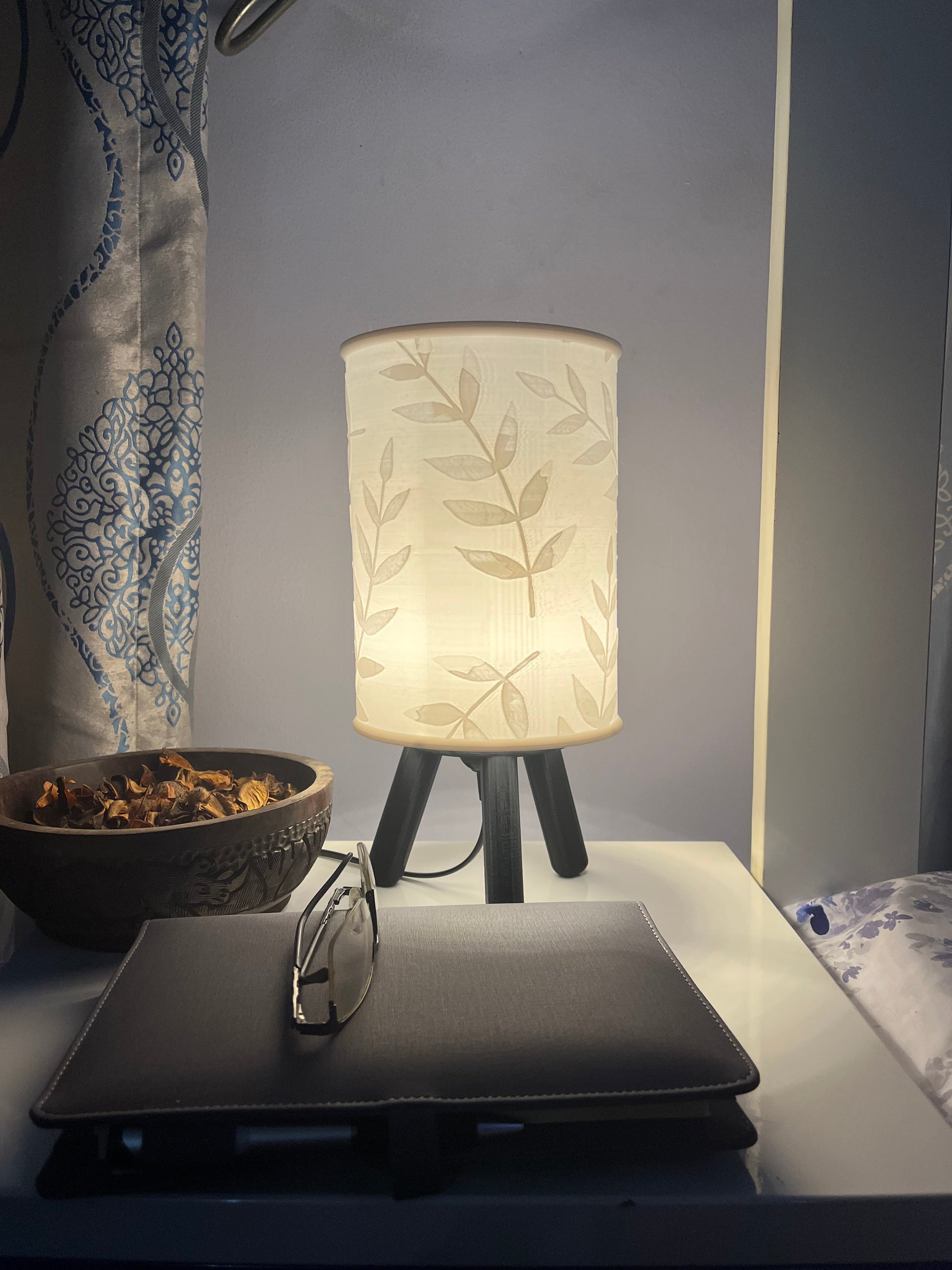 3D printed black Hako bedside/table lamp on a bedside table