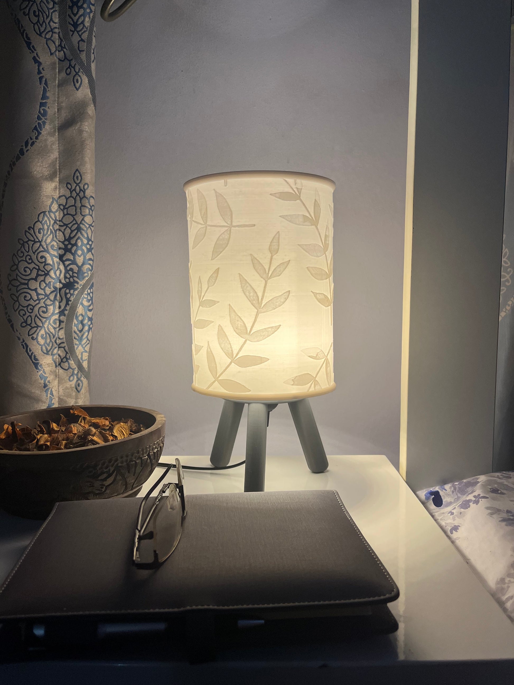 3D printed grey Hako bedside/table lamp on a bedside table